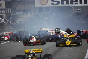 16 Aug 1987, Zeltweg, Austria --- Minardi team Formula One racecars narrowly miss involvement in an accident at the start of them Austrian Grand Prix. --- Image by © Schlegelmilch/Corbis